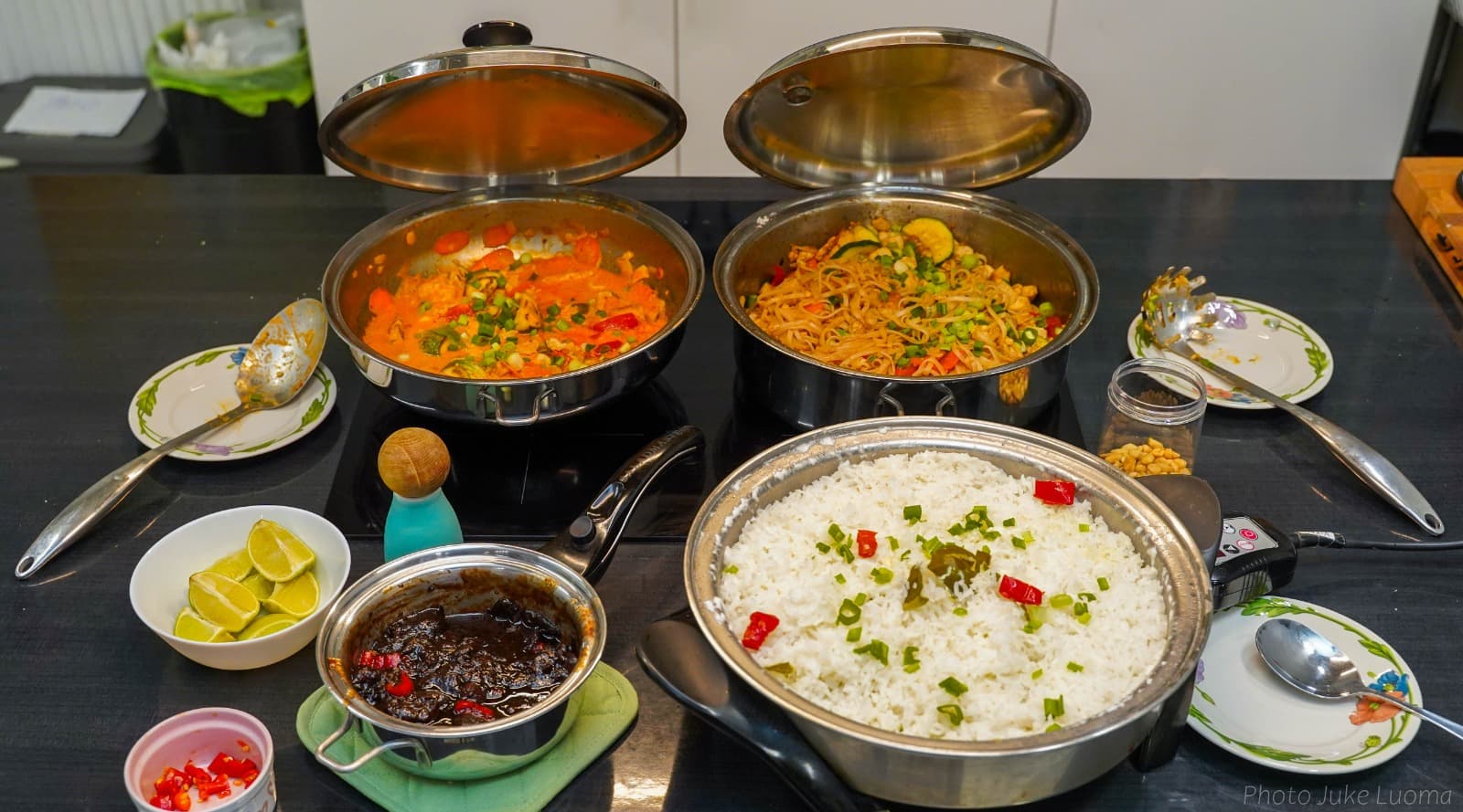 Indonesian curry, noodles, and rice served from Saladmaster pans at a demo