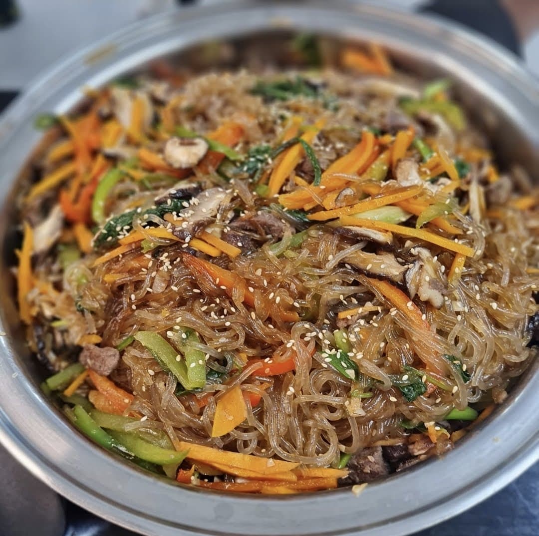 Japchae glass noodles with vegetables and sesame in a Saladmaster pan
