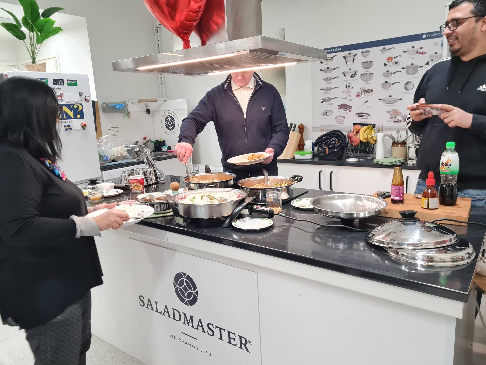 Guests serving themselves at a Saladmaster cooking demo