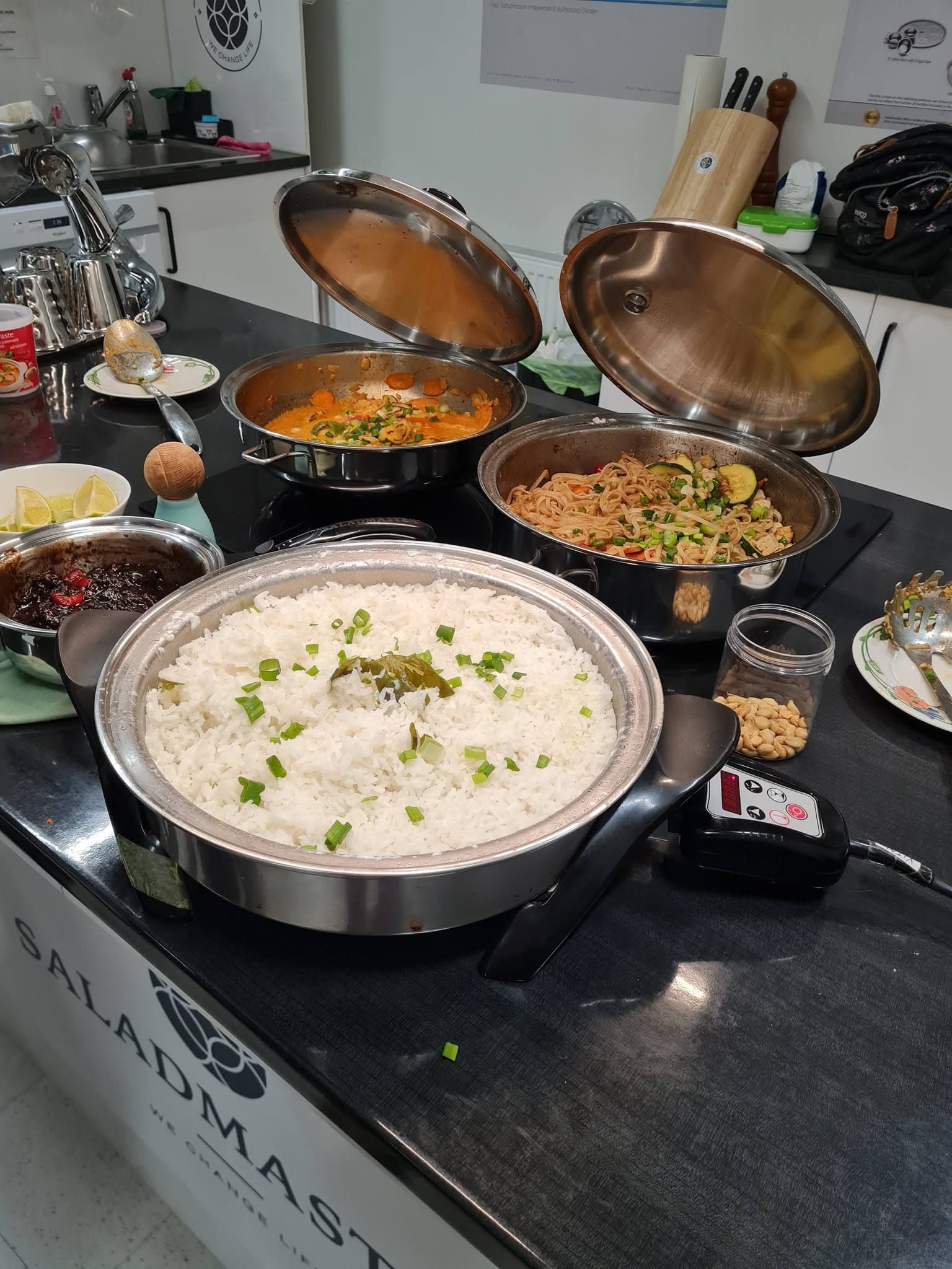 Rice, curry and stir-fried noodles served in Saladmaster cookware