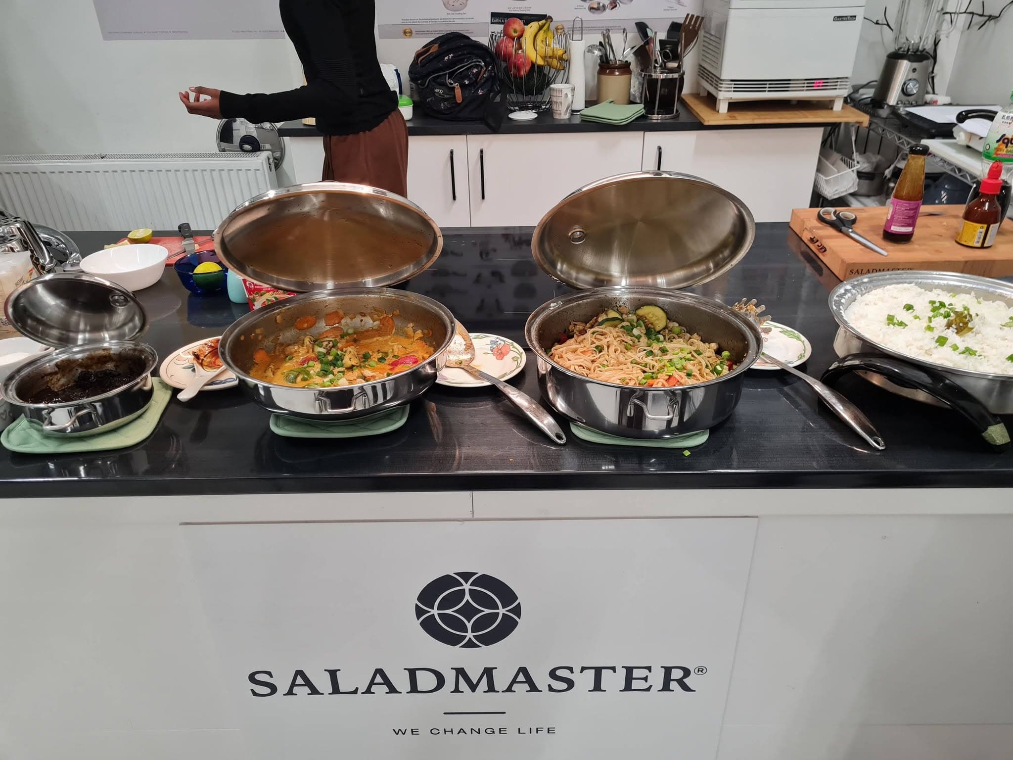 A spread of curry, noodles and rice from a dinner demo